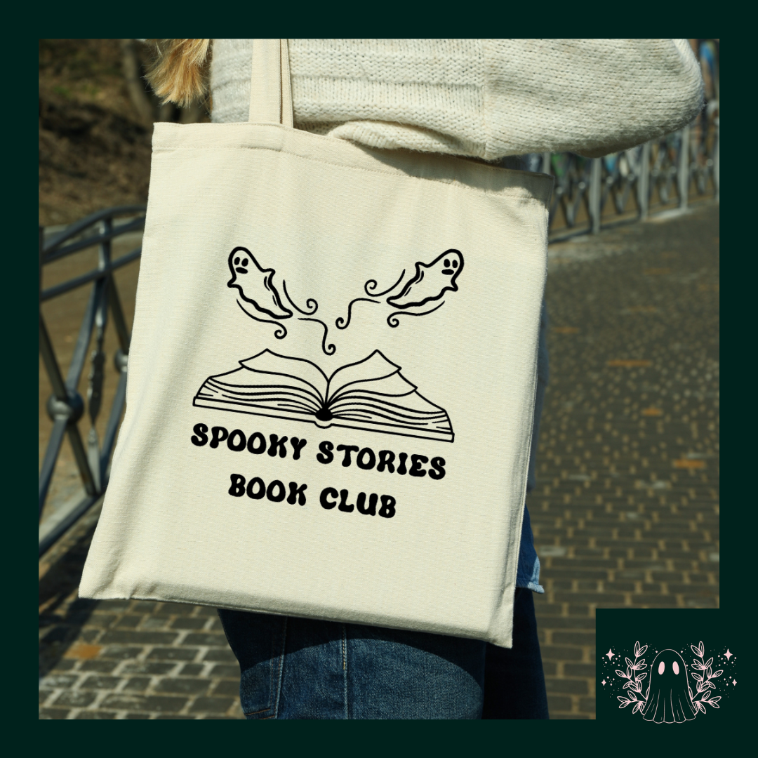 A Mock-up image of a natural canvas cotton tote bag with 'Spooky Stories Book Club' design, an open book with ghosts flying out.